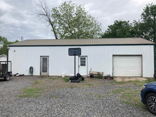 view of front of house featuring metal roof and a garage