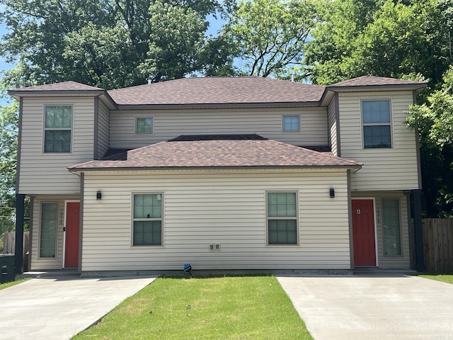 1914 Dennison St, Little Rock, AR 72202 - traditional-style home featuring a front lawn, a patio area, roof with shingles, and fence