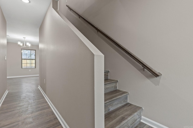 1914 Dennison St, Little Rock, AR 72202 - stairway with baseboards, an inviting chandelier, and wood finished floors