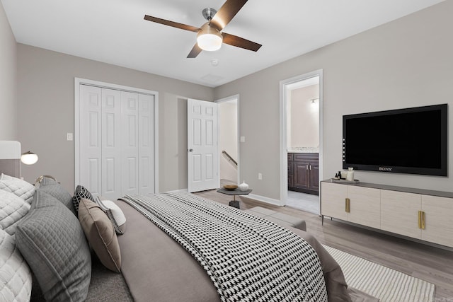 1914 Dennison St, Little Rock, AR 72202 - bedroom with connected bathroom, a ceiling fan, a closet, baseboards, and light wood-style floors