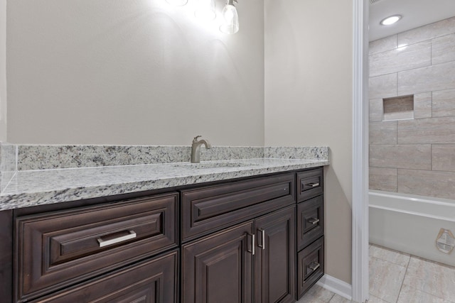 1914 Dennison St, Little Rock, AR 72202 - bathroom featuring shower / bath combination, vanity, baseboards, and tile patterned flooring