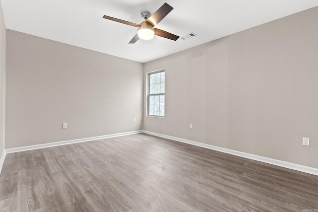 1914 Dennison St, Little Rock, AR 72202 - spare room featuring visible vents, wood finished floors, baseboards, and ceiling fan