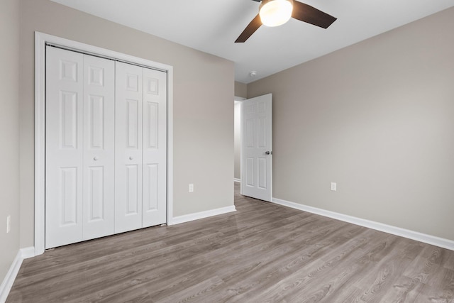 1914 Dennison St, Little Rock, AR 72202 - unfurnished bedroom with baseboards, a closet, light wood-type flooring, and a ceiling fan