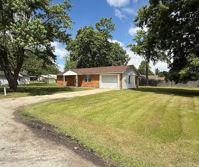 1300 Overdene St, Corning, AR 72422 - view of front facade featuring an attached garage, dirt driveway, fence, and a front lawn