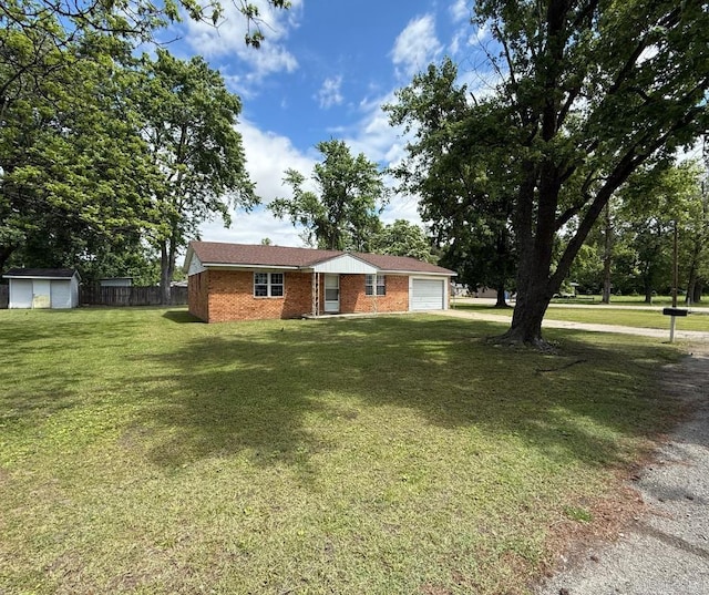 1300 Overdene St, Corning, AR 72422 - view of front of property with brick siding, fence, a garage, a front lawn, and a storage shed