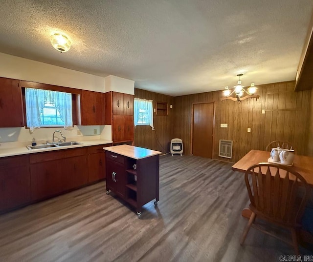 1300 Overdene St, Corning, AR 72422 - kitchen featuring light countertops, open shelves, a sink, and wood finished floors