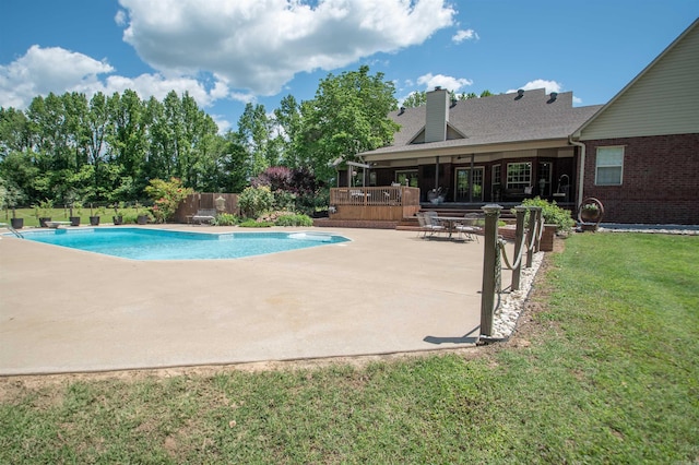 102 Cordell Rd, Beebe, AR 72012 - view of pool with a patio area, fence, a wooden deck, a fenced in pool, and a lawn