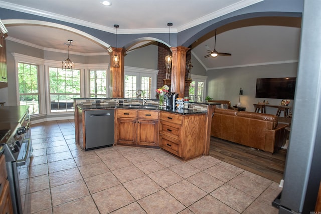 102 Cordell Rd, Beebe, AR 72012 - kitchen featuring a sink, decorative columns, open floor plan, arched walkways, and appliances with stainless steel finishes