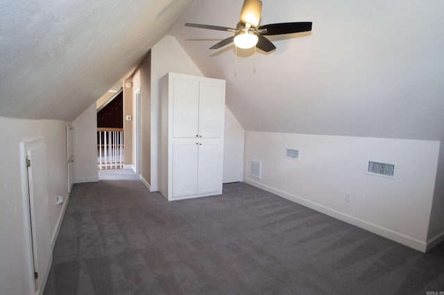 102 Cordell Rd, Beebe, AR 72012 - additional living space with lofted ceiling, baseboards, dark colored carpet, and visible vents