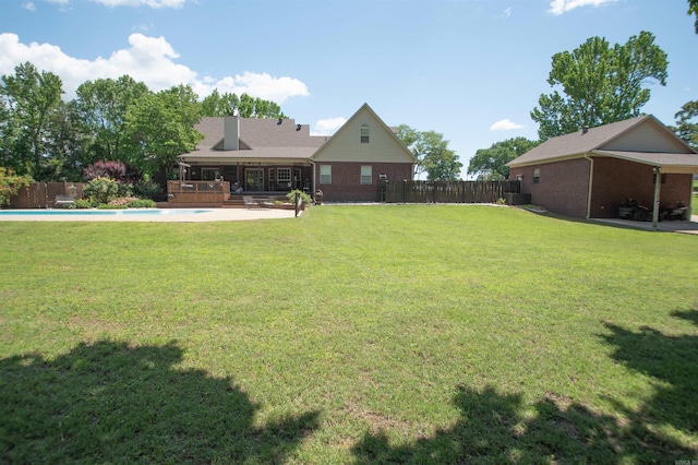 102 Cordell Rd, Beebe, AR 72012 - view of yard featuring a wooden deck, a fenced in pool, and a fenced backyard