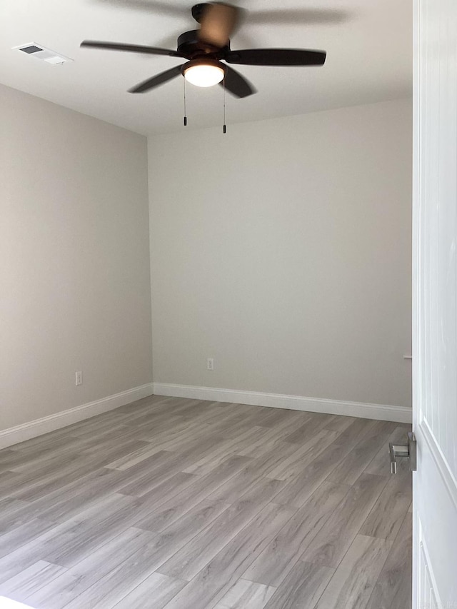 312 Frank T Bunton St, Lonoke, AR 72086 - unfurnished room featuring light wood finished floors, visible vents, baseboards, and ceiling fan