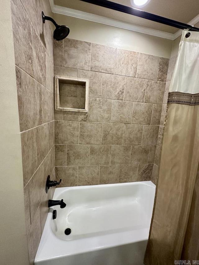 bathroom with crown molding and shower / bathtub combination with curtain
