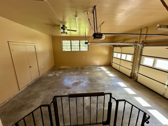 garage with a ceiling fan and a garage door opener