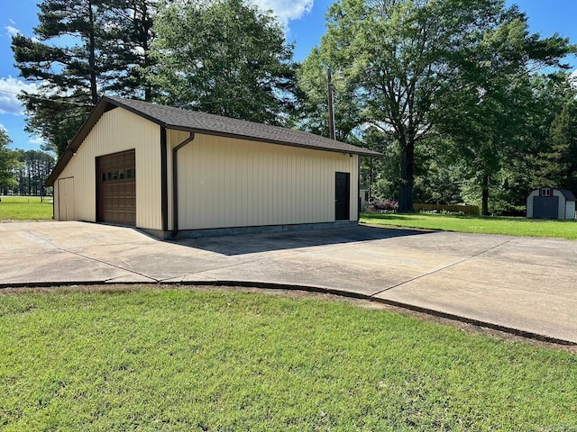 detached garage featuring driveway