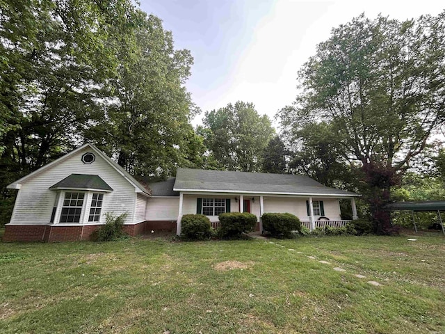 view of front of property with a porch and a front yard