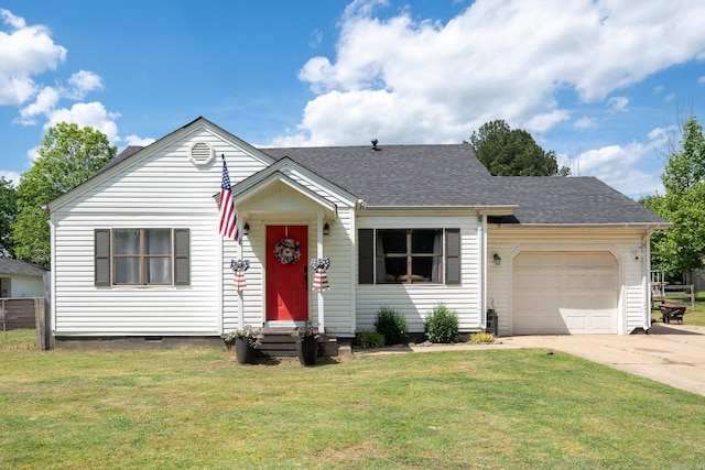 view of front of house with concrete driveway, a garage, a front yard, entry steps, and a shingled roof