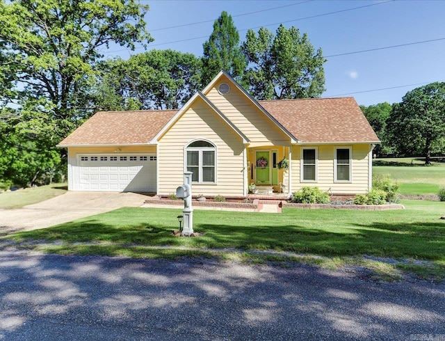 view of front of house featuring concrete driveway, a front lawn, roof with shingles, and an attached garage