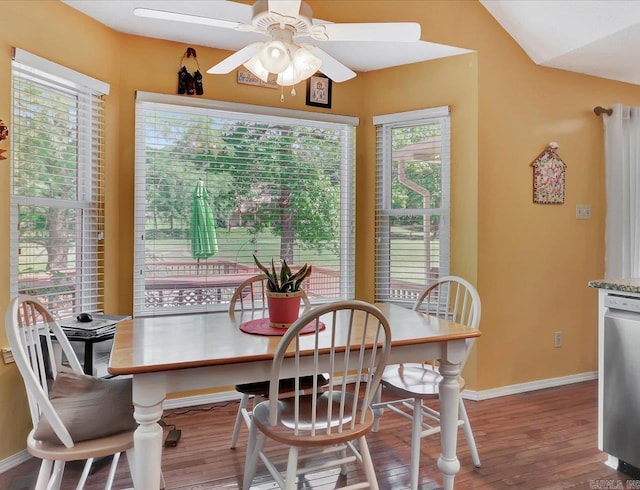 dining area with baseboards, a ceiling fan, and wood finished floors