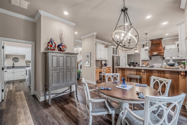 74 Greystone Blvd, Cabot, AR 72023 - dining room featuring baseboards, visible vents, crown molding, dark wood-style floors, and a notable chandelier