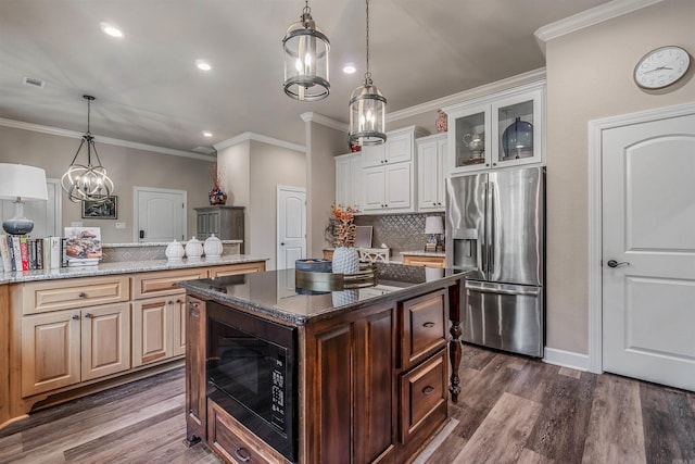 74 Greystone Blvd, Cabot, AR 72023 - kitchen with visible vents, backsplash, a center island, built in microwave, and stainless steel fridge with ice dispenser