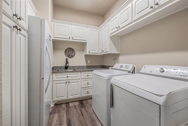 74 Greystone Blvd, Cabot, AR 72023 - clothes washing area featuring a sink, cabinet space, dark wood-type flooring, and washer and dryer