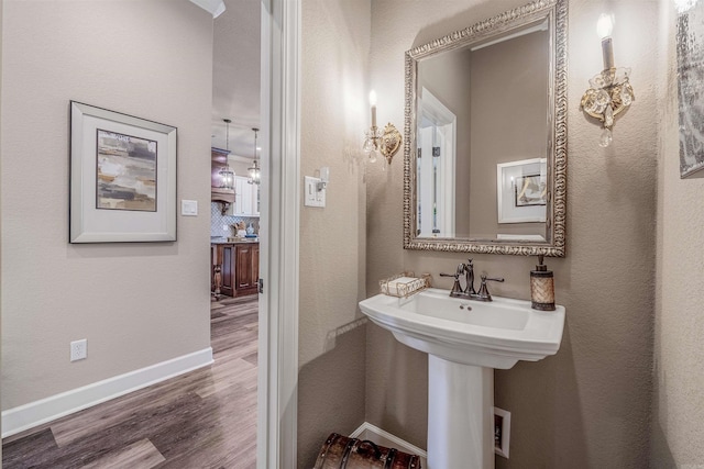 74 Greystone Blvd, Cabot, AR 72023 - bathroom with baseboards, a sink, and wood finished floors