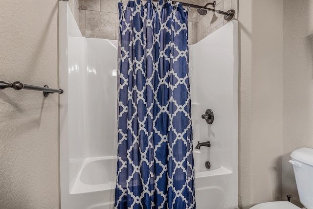 74 Greystone Blvd, Cabot, AR 72023 - full bath featuring toilet, a textured wall, and shower / bathtub combination with curtain
