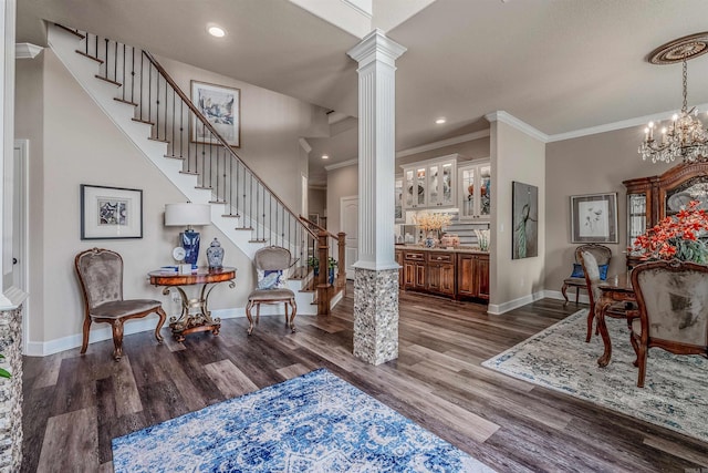 74 Greystone Blvd, Cabot, AR 72023 - entryway with stairway, crown molding, ornate columns, and dark wood-type flooring