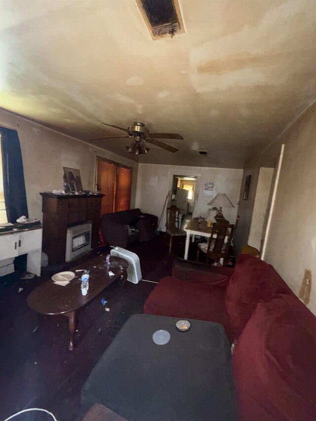 living room with ceiling fan and visible vents
