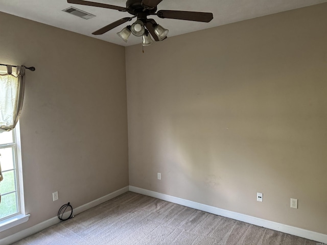 1360 Champions, Conway, AR 72034 - spare room with light colored carpet, baseboards, a ceiling fan, and visible vents