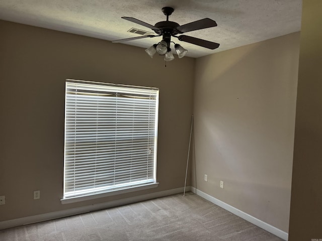 1360 Champions, Conway, AR 72034 - carpeted spare room with a textured ceiling, baseboards, and a ceiling fan