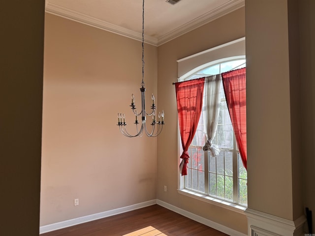1360 Champions, Conway, AR 72034 - unfurnished dining area with crown molding, a notable chandelier, dark wood-style floors, and baseboards