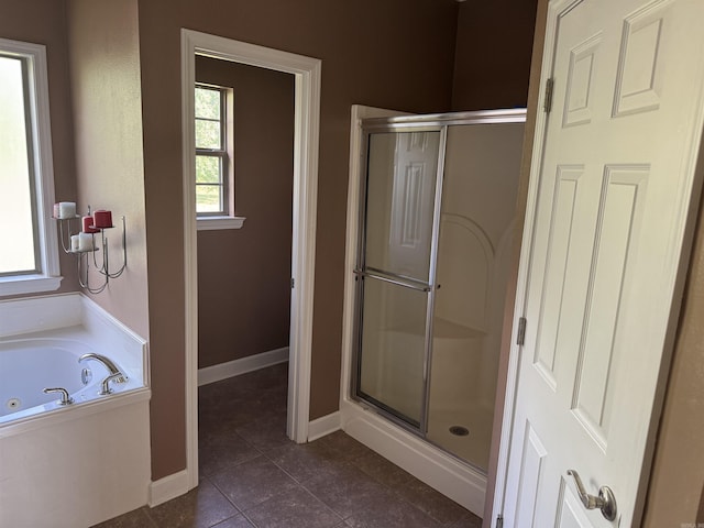 1360 Champions, Conway, AR 72034 - full bathroom featuring a whirlpool tub, baseboards, tile patterned flooring, and a shower stall