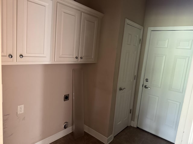 1360 Champions, Conway, AR 72034 - clothes washing area with cabinet space, dark tile patterned flooring, baseboards, and hookup for an electric dryer