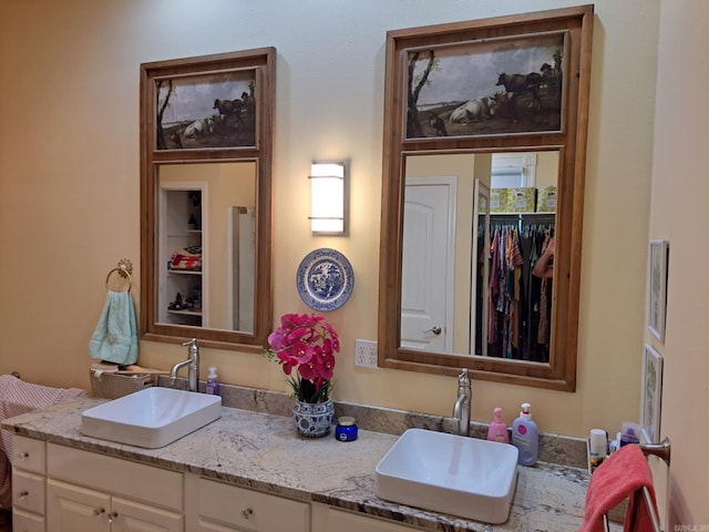 320 E 4th St, Lonoke, AR 72086 - full bathroom with double vanity and a sink