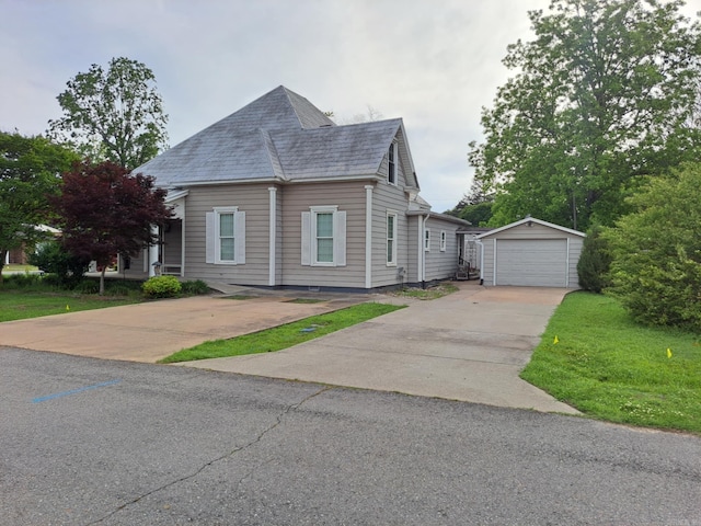 320 E 4th St, Lonoke, AR 72086 - view of front of home featuring roof with shingles, an outdoor structure, a garage, and driveway