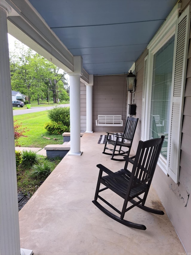 320 E 4th St, Lonoke, AR 72086 - view of patio / terrace with a porch