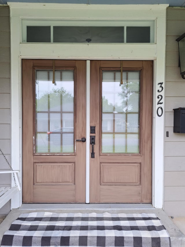 320 E 4th St, Lonoke, AR 72086 - view of exterior entry featuring covered porch