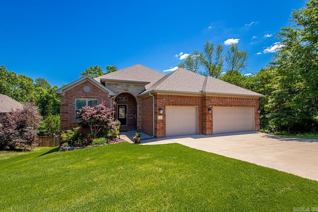 view of front of home featuring driveway, brick siding, a garage, a shingled roof, and a front lawn