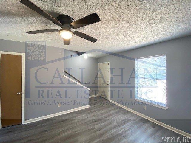 5732 Camp Robinson Rd, North Little Rock, AR 72118 - additional living space with a textured ceiling, baseboards, a ceiling fan, and wood finished floors
