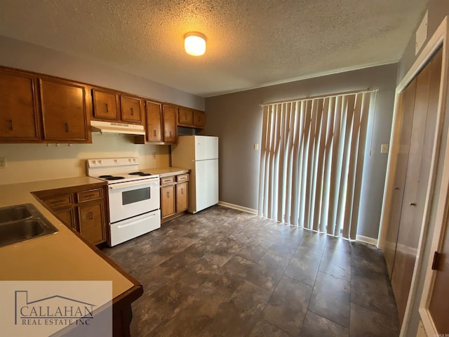 5732 Camp Robinson Rd, North Little Rock, AR 72118 - kitchen featuring a sink, white appliances, brown cabinets, a textured ceiling, and under cabinet range hood