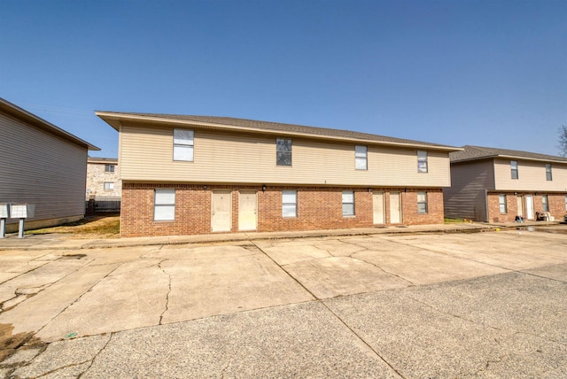 5732 Camp Robinson Rd, North Little Rock, AR 72118 - back of house with a patio and brick siding