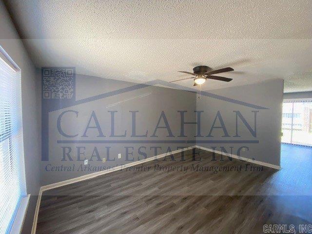 5732 Camp Robinson Rd, North Little Rock, AR 72118 - interior space with vaulted ceiling, ceiling fan, a textured ceiling, and wood finished floors