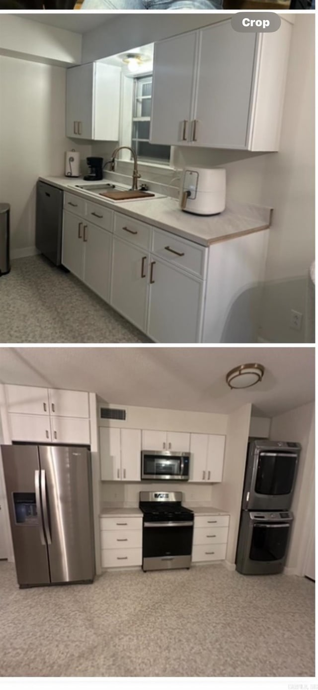 kitchen featuring light countertops, white cabinetry, stainless steel appliances, and a sink