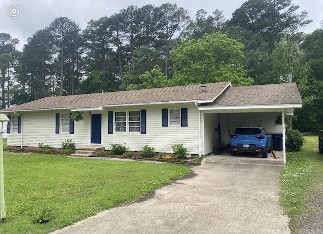 804 Elm St, Smackover, AR 71762 - single story home featuring a front yard, driveway, and an attached carport
