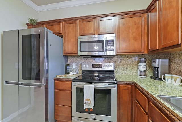 kitchen featuring backsplash, brown cabinets, ornamental molding, and stainless steel appliances