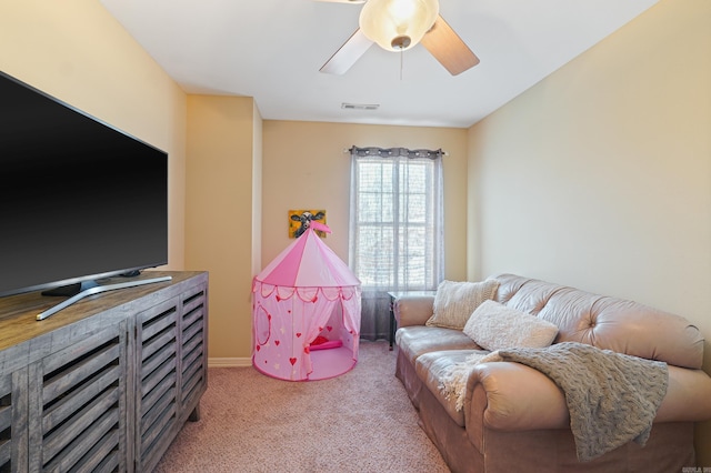 recreation room featuring a ceiling fan, light carpet, and visible vents