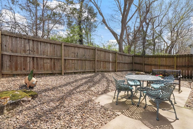 view of patio / terrace with outdoor dining area and a fenced backyard