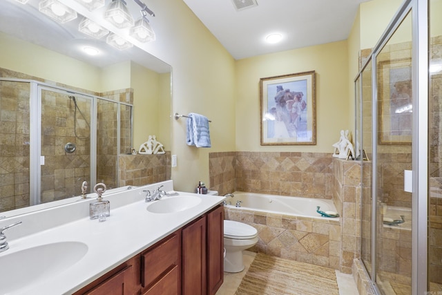 bathroom featuring a garden tub, a shower stall, and a sink