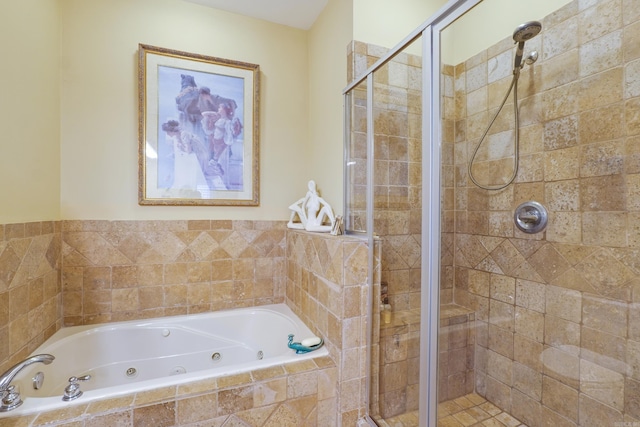 full bathroom with a jetted tub and a shower stall